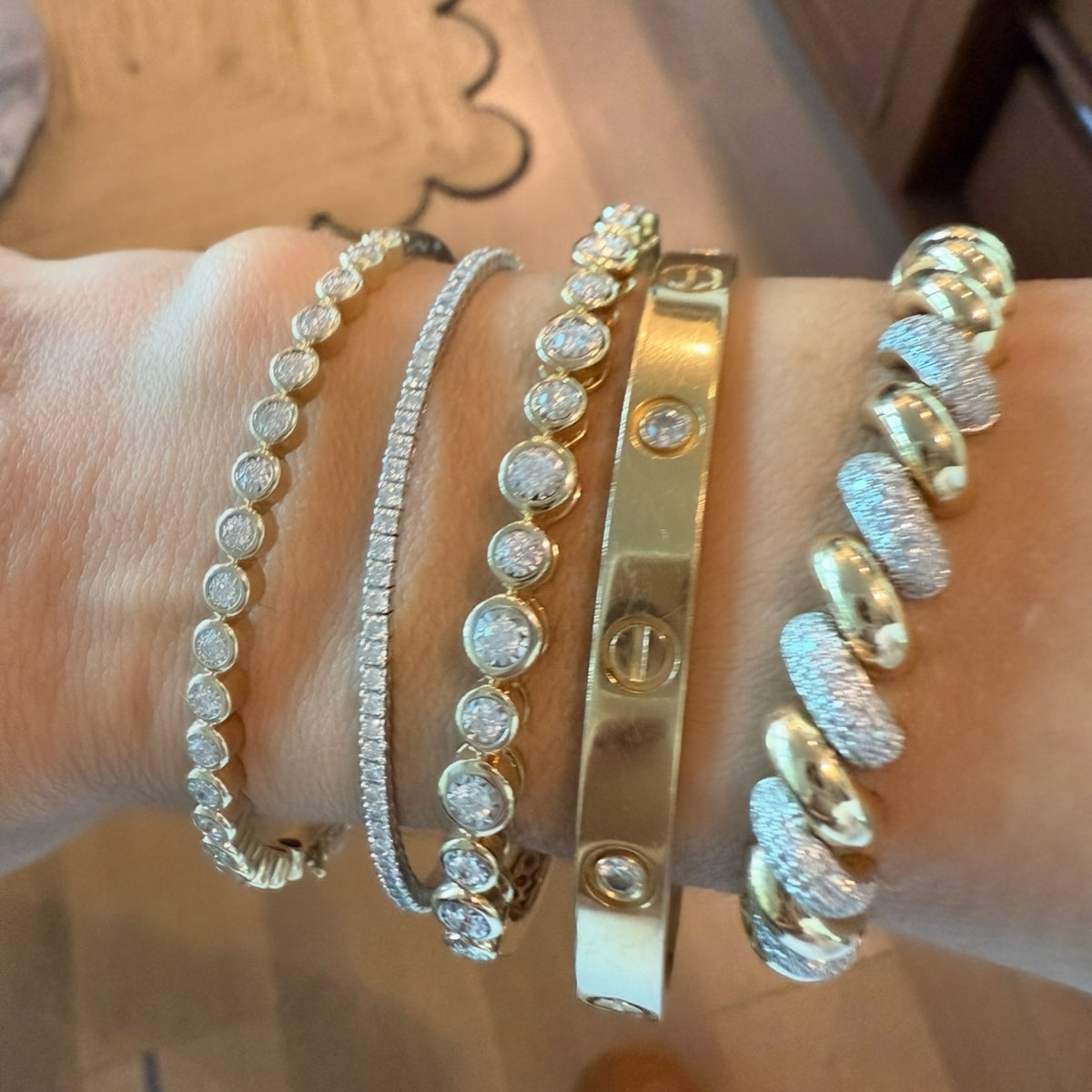 14KT Gold Diamond The Line Alternating Size Bezel Set Bangle