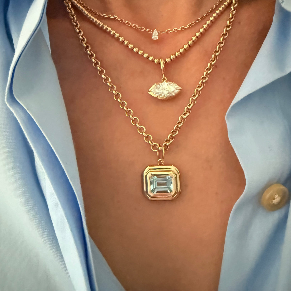 14KT Gold East West Emerald Cut Blue Topaz Pendant Charm