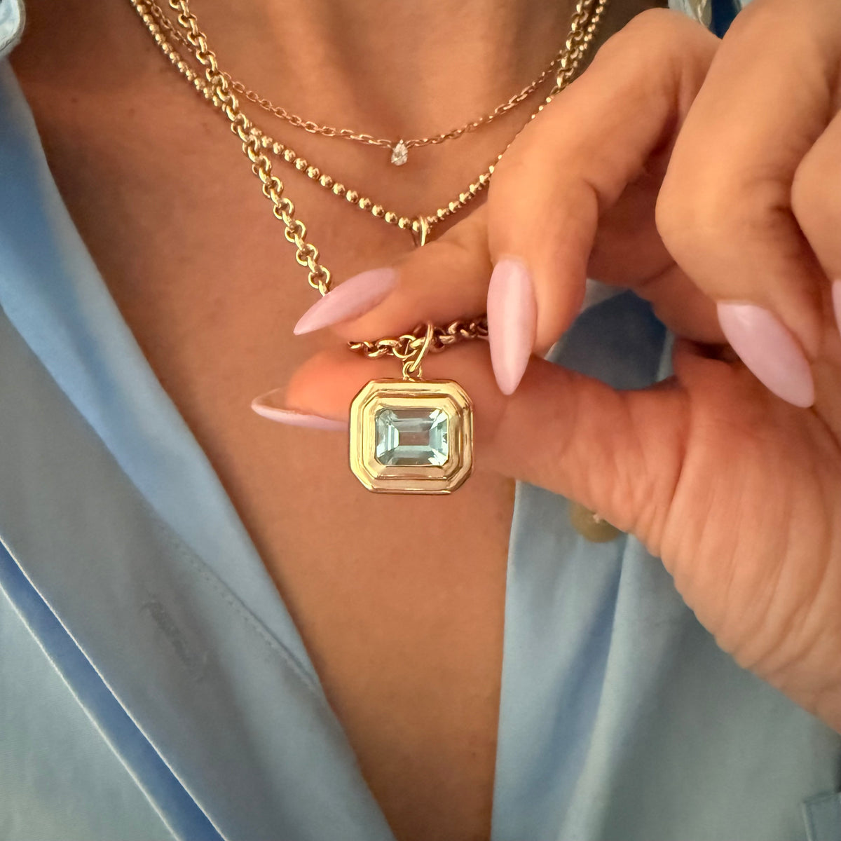 14KT Gold East West Emerald Cut Blue Topaz Pendant Charm